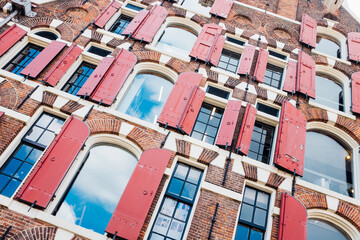 Facade of a Typical Amsterdam House in the Netherlands, Showcasing Iconic Architecture and Historic Urban Charm