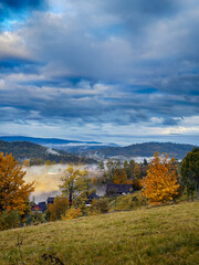 Sunny Autumn Carpathians with Puffy White Clouds
