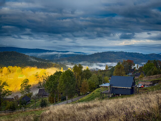 Sunny Autumn Carpathians with Puffy White Clouds