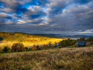 Sunny Autumn Carpathians with Puffy White Clouds