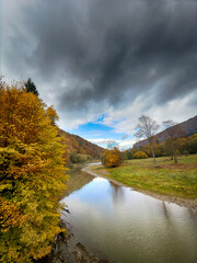 Sunny Autumn Carpathians with Puffy White Clouds