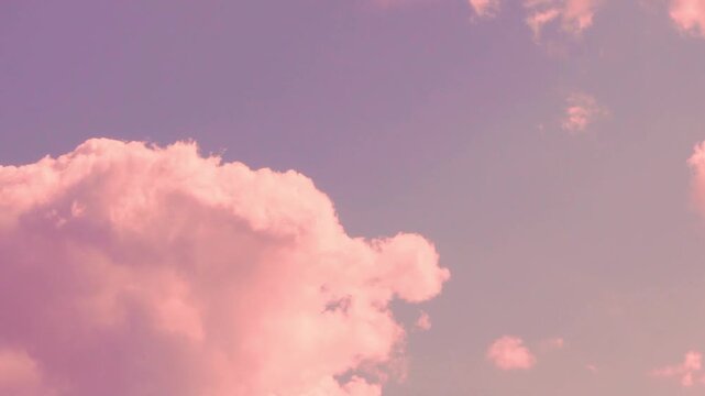 Airplane window view, aerial drone view lilac sunset sky puffy pink orange clouds in sunlight fast time lapse. Amazing blue scyscraper and peach cloudscape, firmament, atmosphere, colorful sky cloud.
