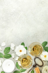 Fototapeta premium Wine Tasting Flat Lay with Roses, Petals, and Corkscrew