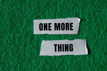 One More Thing message written on ripped torn paper background. Conceptual One More Thing symbol. Copy space.