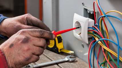 electrician fixing electrical wires