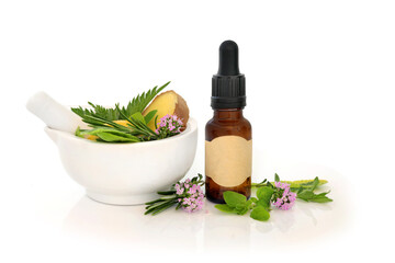 Herbal medicine for Summer hayfever allergies , tincture bottle, mortar, ginger spice, thyme, sage, nettle, rosemary, marjoram herbs. Antihistamine herbs.