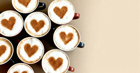 Cappuccino coffee cups with heart art on beige background, text space, top view