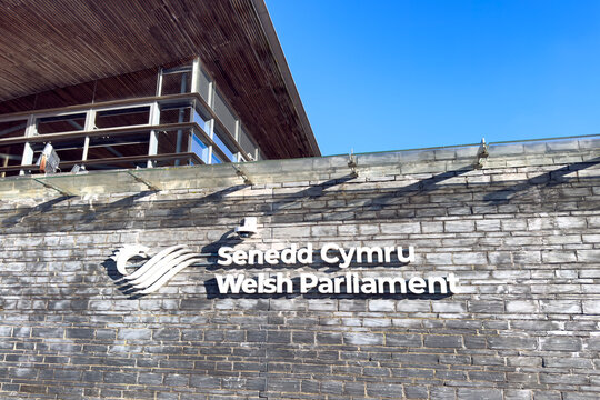 Cardiff, UK - 25 Nov 2025: Welsh Parliament building and blue sky, constructed from local slate, Cardiff, Wales. A democratically elected body that represents the interests of Wales. 