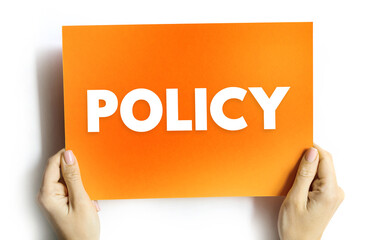 POLICY text on card held by hands, conceptual message for regulations, company rules, compliance, and corporate ethics visual, modern clean typography on plain background