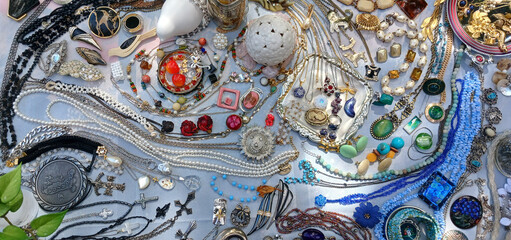 Second hand vintage jewelry arranged in wave pattern