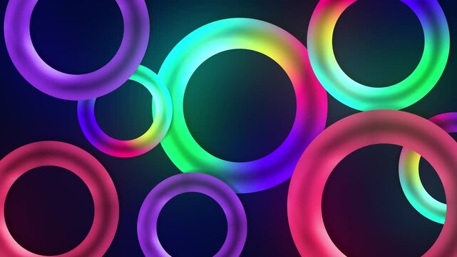Floating circular multicolour glowing neon 3D torus loop rings on a dark gradient background creating vivid visual shapes vibrant abstract elements dynamic motion graphic animations purple red green