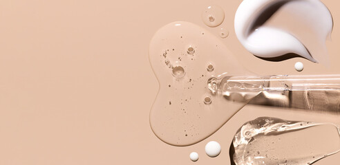 pipette drop of serum test, samples of cosmetic care products smears of cream gel texture on a...