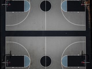 Aerial view of stark geometry of basketball courts pops with clean lines and contrasting dark and light hues, a study in urban sport, Boston, Massachusetts, United States.