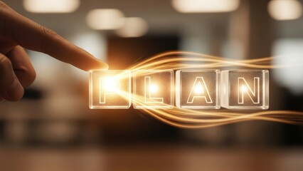 Finger touches glowing cubes spelling the word plan