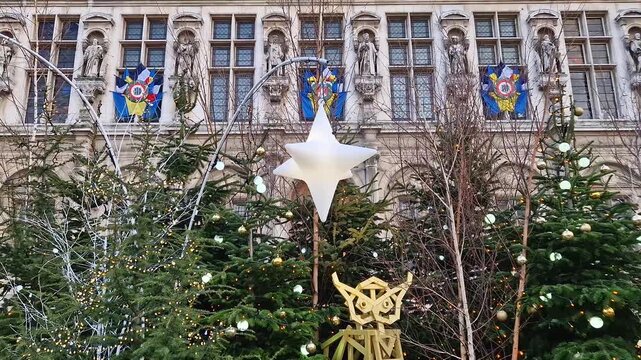 Paris, France - December 10, 2025: Hotel de Ville in Paris during the winter holidays decorated with Christmas trees and festive lights