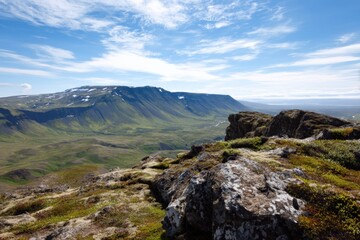 Majestic mountain landscape with blue sky and rocky foreground