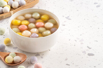 Colorful sweet glutinous rice balls tangyuan in sweet ginger syrup soup