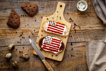 Two homemade sandwiches with image of american flag.