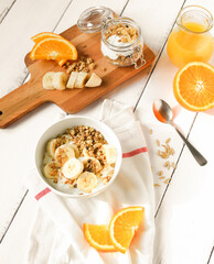 breakfast on wooden table with granola top view