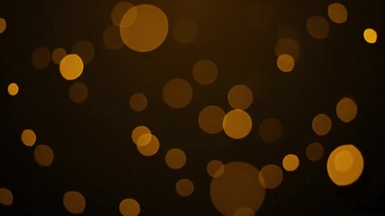 Elegant dark background illuminated by a beautiful scattering of warm golden bokeh lights, creating a magical and celebratory atmosphere for various designs