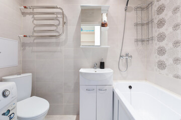 modern bathroom room with toilet and washing machine
