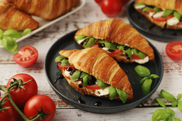 Croissants with mozarella cheese and tomatoes in caprese style
