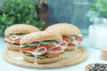 Bun sandwiches with salami and vegetables	