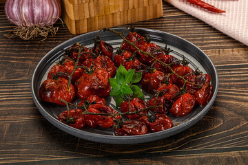 Baked cheeryy momatoes with olive oil