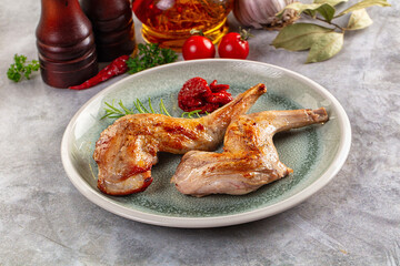 Roasted rabbit leg served rosemary