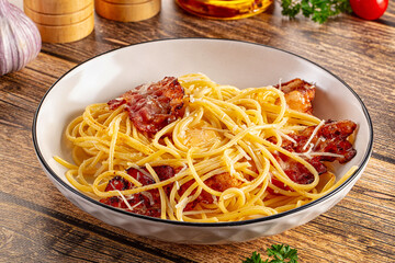 Italian classic spaghetti carbonara with bacon and egg