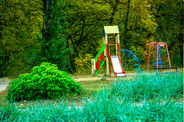 Children's corner against the backdrop of autumn park foliage.