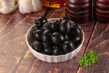 Mediterranean marinated Black olives in the bowl