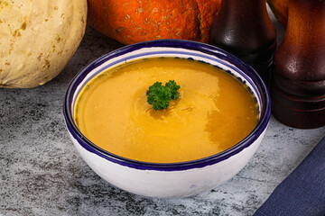 Vegan pumpkin cream soup served sesam