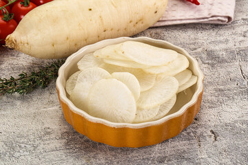 Sliced white daikon radish in the bowl