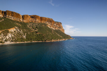 Aerial view of the dramatic Cap Canaille cliffs meet the tranquil azure sea, a stunning contrast of earth and water, Cassis, Provence-Alpes-Cote d Azur, France.