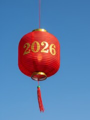 Obraz premium Chinese Lunar New Year banner with red lantern against clear blue sky, 2026