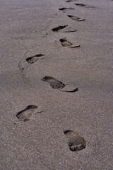 Footprints in volcanic sand at El Bollullo