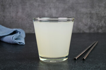 Lychee juice served in a glass cup.