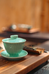 Minimalist close-up of a small ceramic tea cup used in traditional tea ceremonies, highlighting simplicity, texture, craftsmanship, and the calm aesthetic of mindful tea drinking.
