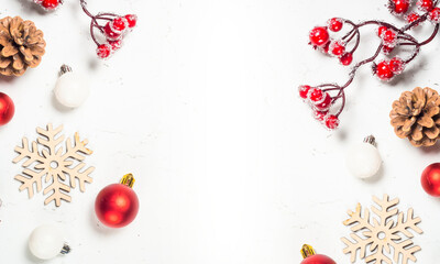 Festive christmas border design with red berries pinecones ornaments and wooden snowflakes on on transparent background