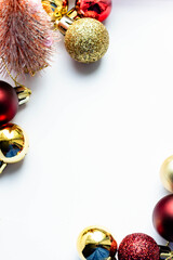 New Year background, bright red and gold balls on a white background, vertical frame