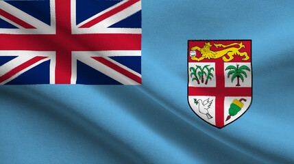 Fiji flag featuring its coat of arms waving gently in the breeze under bright blue sky