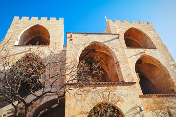 Majestic Torres de Serranos gate stands against sky in Valencia, Spain. Impressive example of Gothic military architecture is a major historical landmark