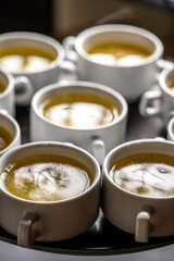 Hot Clear Broth Served In White Cups