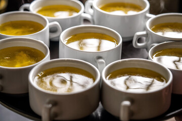 Hot Clear Broth Served In White Cups
