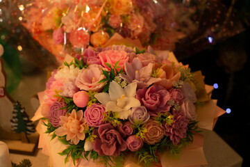 Decorative soap shaped as flowers arranged into a fragrant bouquet. Handmade cosmetic product combining hygiene, scent, and gift presentation. Beautiful Soap close-up