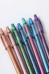 Set of colorful glitter markers on white background, glitter pens
