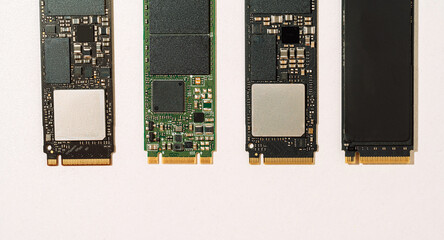 Four M.2 SSD boards top view with copy space on white background. High quality photo