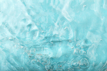Blue water background. Tranquil light blue water background showcases gentle ripples and bubbles, evoking sense of calmness and serenity in aquatic environment filled with soothing textures and hues