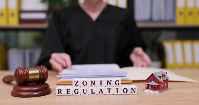 Important discussions on zoning regulations take place in a busy office setting with a focus on community and property development